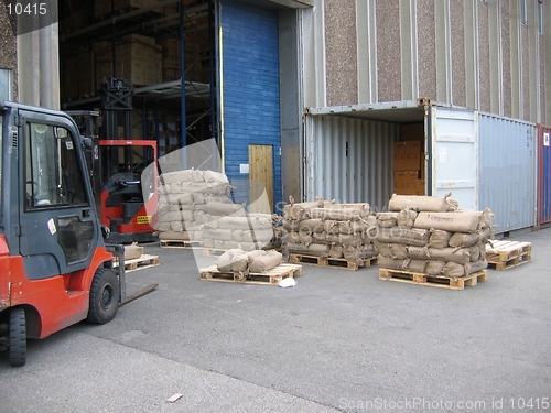 Image of Unloading container outside warehouse