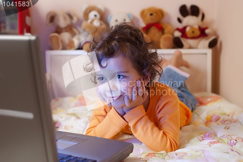 Image of little girl in front of a laptop