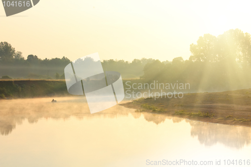 Image of fishing on river in fog