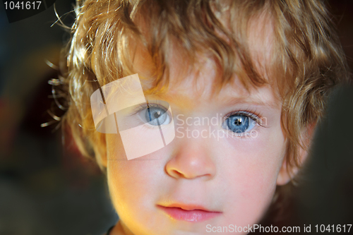 Image of baby with blue eyes in sunlight