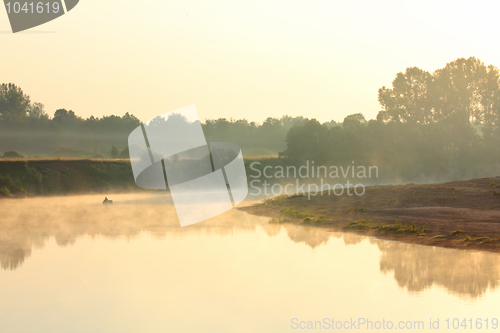 Image of fishing on river in fog