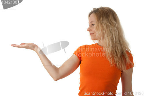 Image of Nice young woman holding her hand palm up