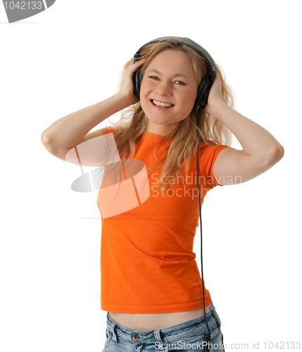 Image of Smiling girl listening to music in headphones