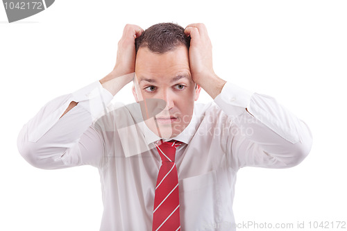 Image of Strongly afflicted business man, with hands on head