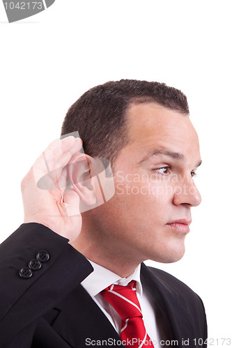 Image of businessman, listening, viewing the  gesture of hand behind the ear