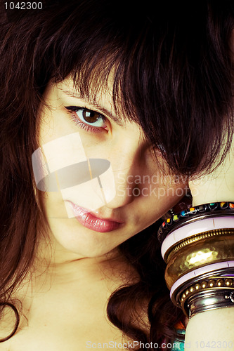 Image of brunette lady with bracelets