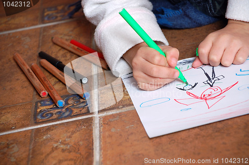 Image of child drawing people