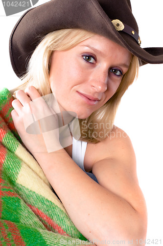 Image of girl in a cowboy hat with wrapped in a plaid 