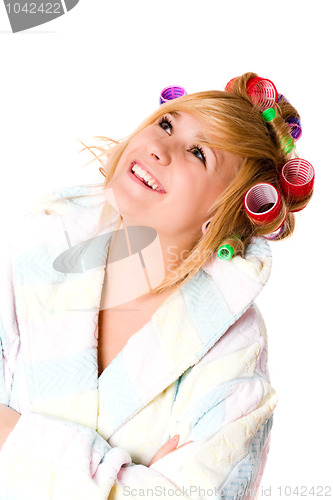 Image of happy housewife with curlers