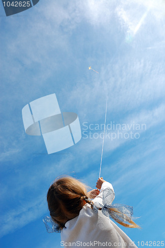 Image of child flying a kite