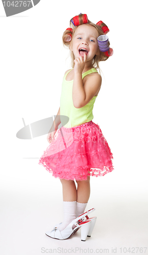 Image of I'm fashion says little girl in women's shoes and rollers
