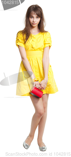 Image of Girl in yellow with red purse
