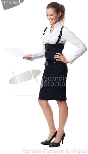 Image of Business woman laughing holding a document