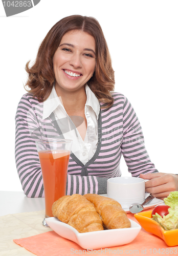 Image of Woman smiling having breakfast