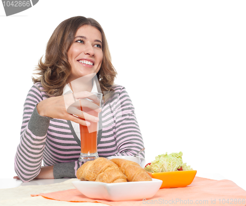 Image of Happy woman having light breakfast