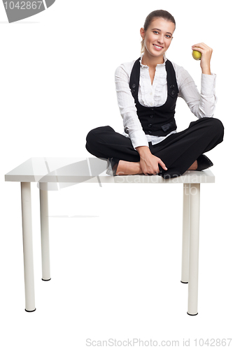 Image of Business woman sit on table with apple