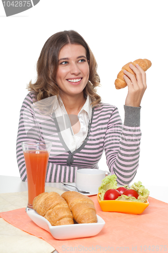 Image of Happy woman with croissant