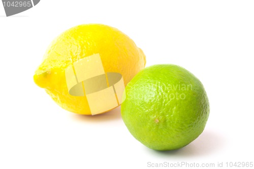 Image of Close up of fresh green lime and lemon isolated on white