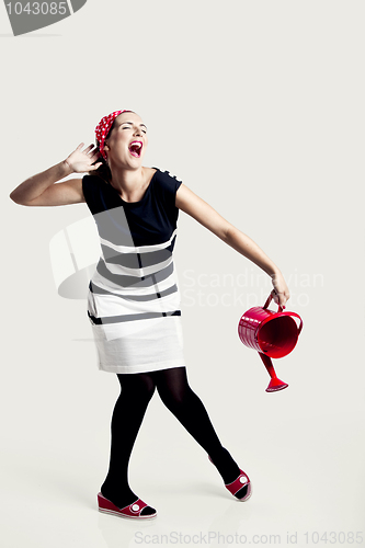 Image of Portrait of a beautiful fashion woman posing and holding a red w