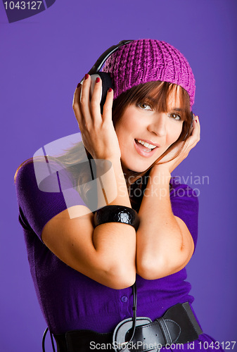 Image of Beautiful woman listening music