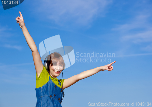Image of Happy woman listen music
