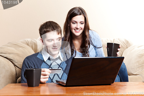 Image of Happy couple shopping online