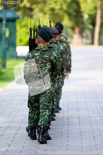 Image of Soldiers in camouflage marching