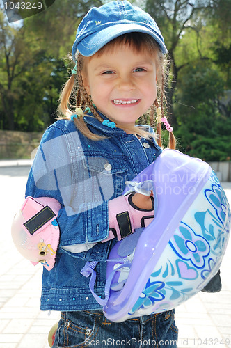 Image of child with helmet in the park