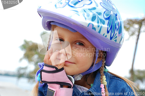 Image of smiling child wearing protective helmet