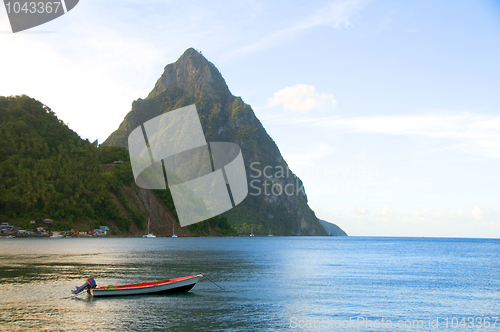 Image of soufriere st. lucia twin piton mountain peaks with fishing boat 