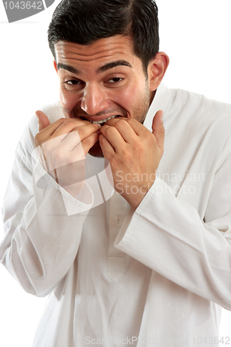 Image of Man biting fingernails anxiety stress or terrified