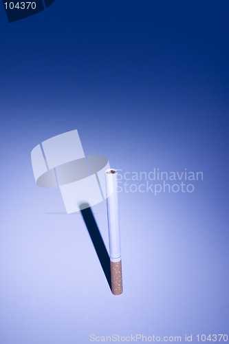 Image of Isolated Cigarette Under Blue Light