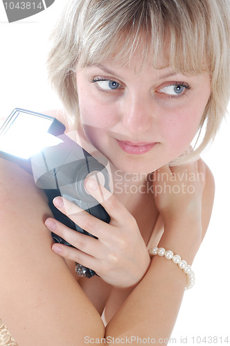 Image of beautiful blond woman with a flash