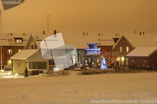 Image of Christmas house in night blue light.