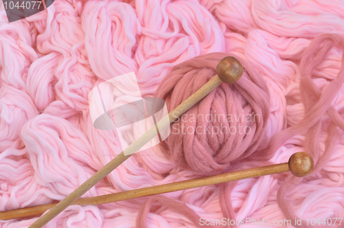 Image of Sphere of pink wool with needles