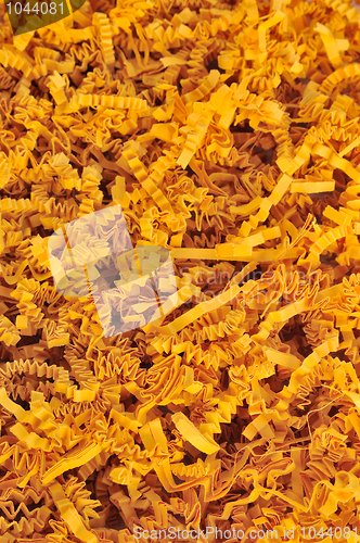 Image of Detail of orange shredded packaging paper - background