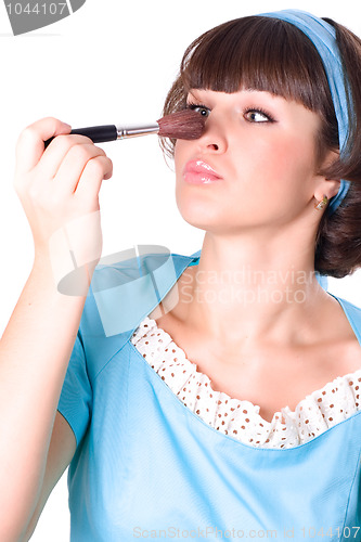 Image of woman with make-up brush