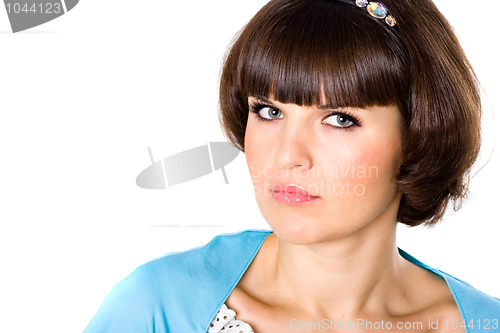 Image of attractive brunet woman in blue dress