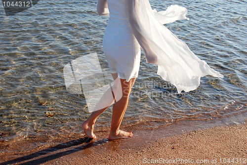 Image of Walking by sea on sand