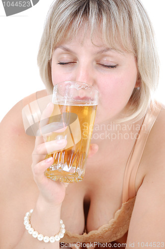 Image of beautiful blond woman drinking beer