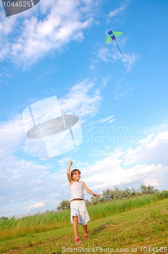 Image of girl playing with a kite