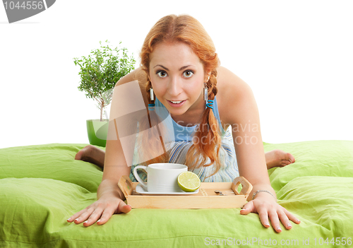 Image of Tea with lemon in bed
