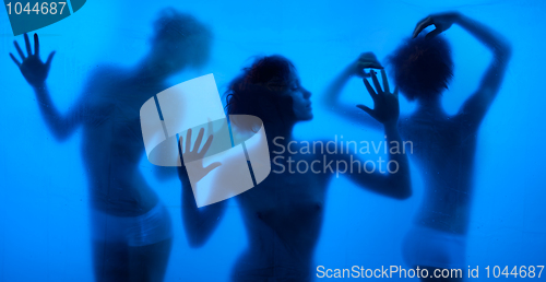 Image of Moving and dancing silhouettes of women