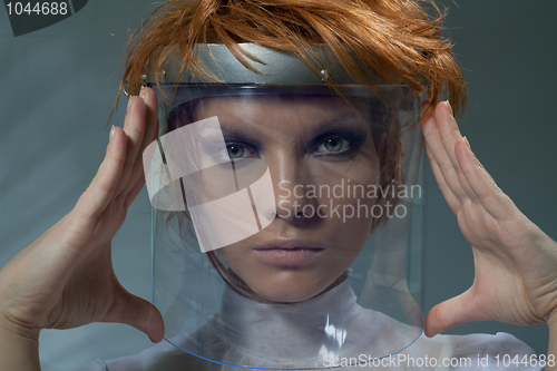 Image of Serious clever woman in glass mask