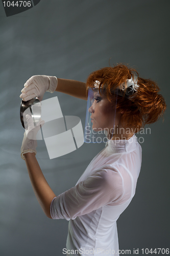 Image of laboratory woman examining detail
