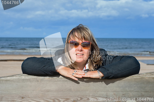 Image of Woman relaxing at the sea.