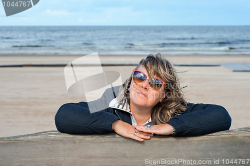 Image of Woman relaxing at the sea.
