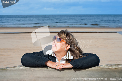 Image of Woman relaxing at the sea.