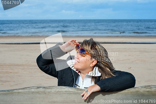 Image of Woman relaxing at the sea.