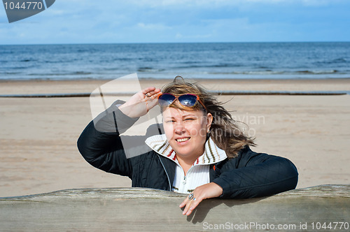 Image of Woman relaxing at the sea.